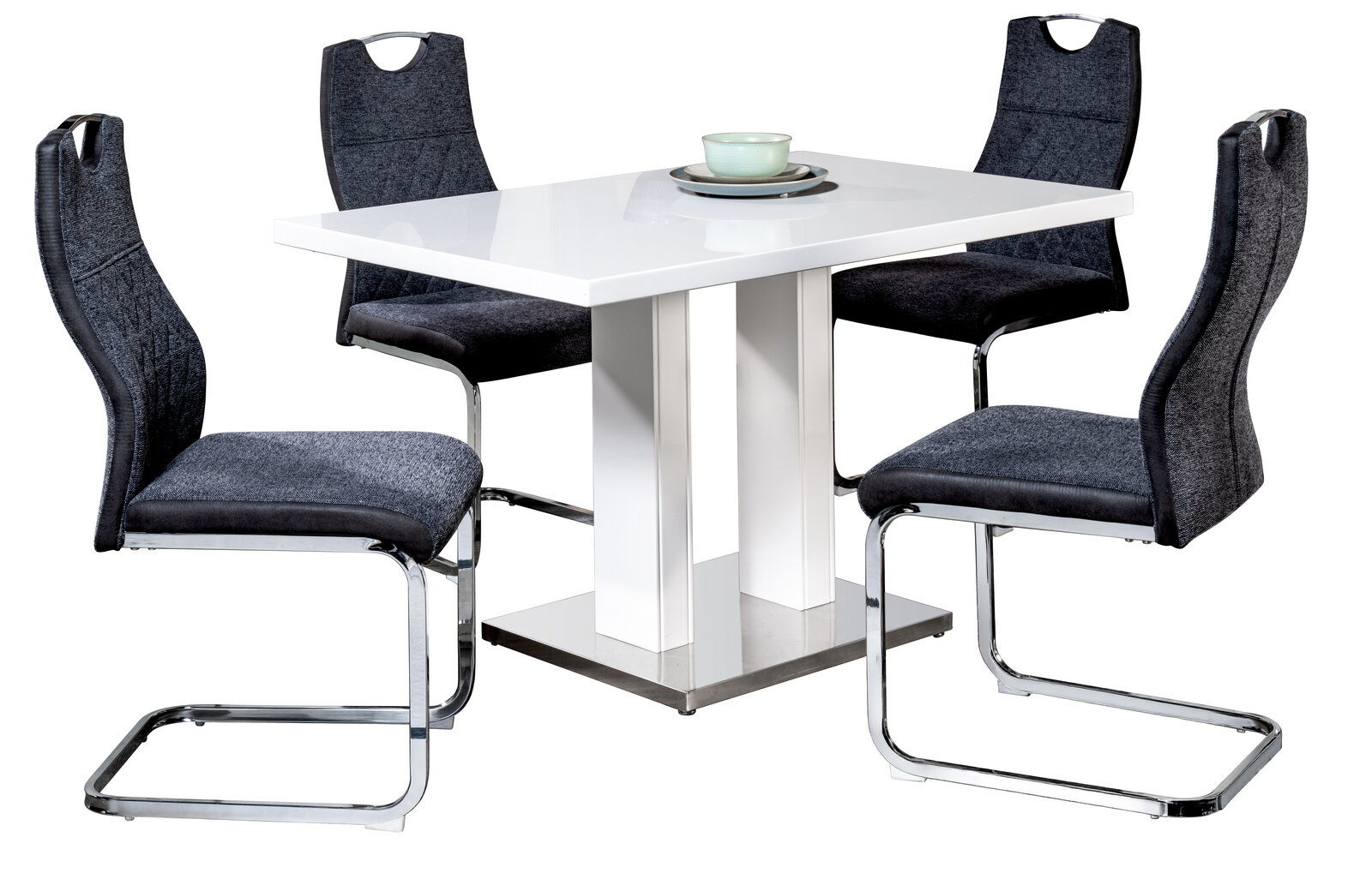 Moderner Schwingstuhl in Dunkelgrau mit verchromtem Gestell, um einen weißen Tisch arrangiert, seitliche Perspektive.