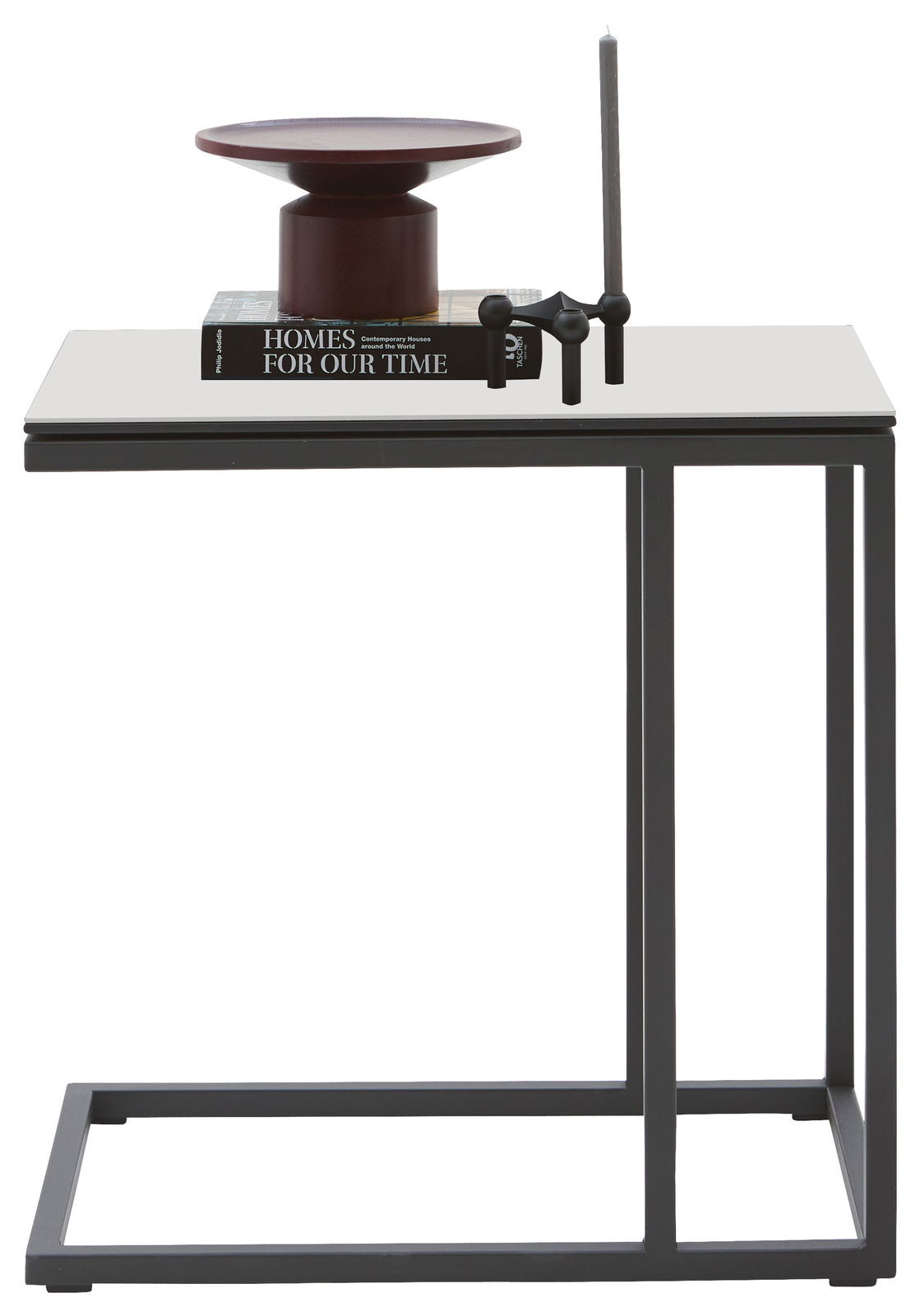 Moderner Beistelltisch mit schwarzem Metallrahmen und heller Tischplatte, seitliche Perspektive. Dekoriert mit einem Buch, einer Kerze und einer Schale.