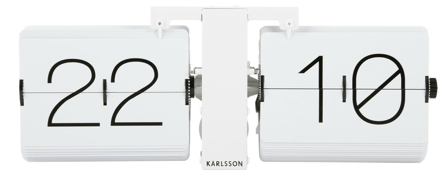 Moderne Wanduhr mit Klappzahlen, frontal abgebildet, zeigt die Uhrzeit 22:10.