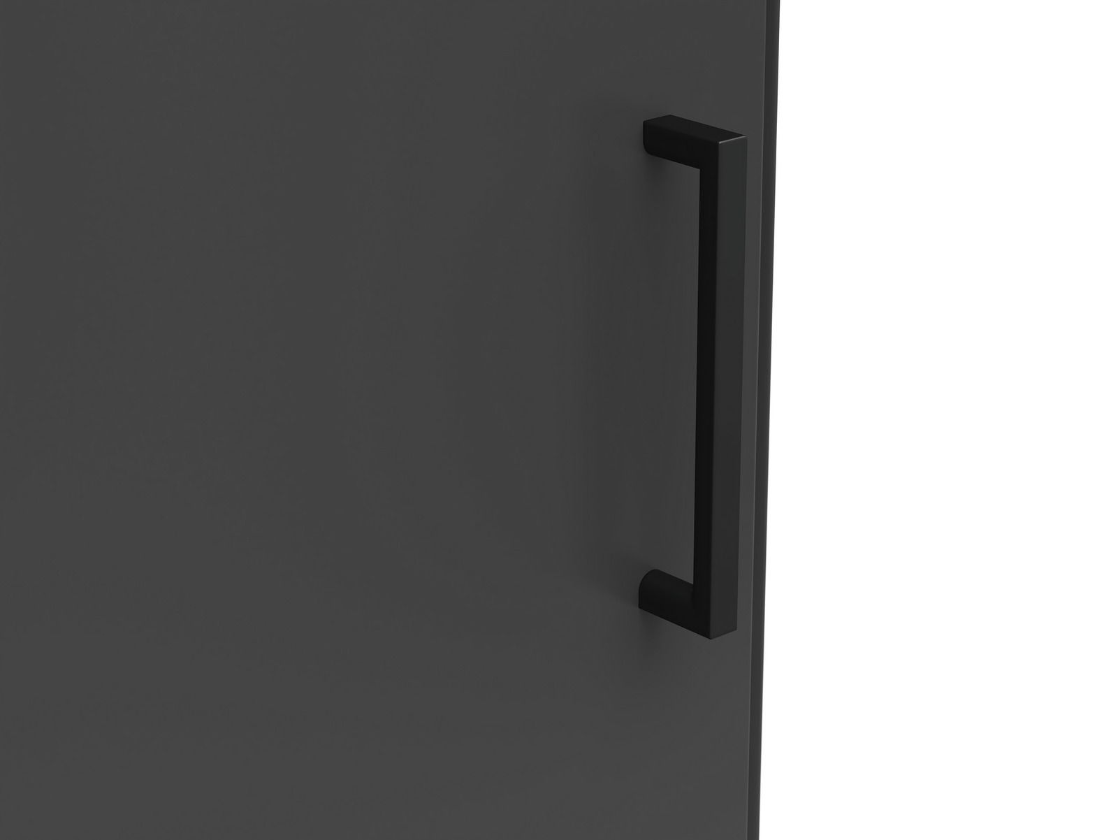 Nahaufnahme eines schwarzen Griffs an einer dunklen Oberfläche, seitliche Perspektive.