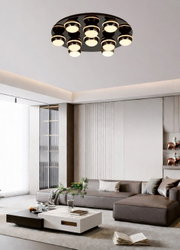 Moderne led-plafondlamp met negen ronde lampen, van onderaf gezien in een stijlvolle woonkamer.
