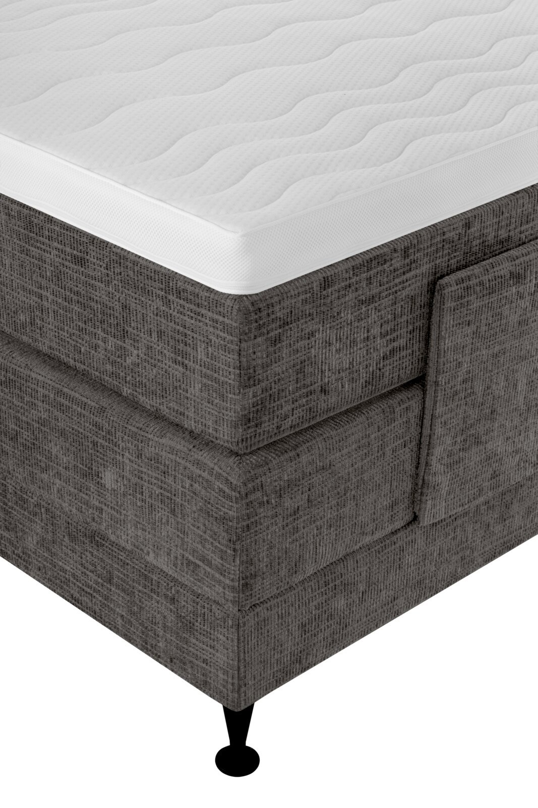 Detailaanzicht vanuit schuin bovenperspectief van een donkergrijs gestoffeerd boxspringbed met wit, golvend doorgestikt matras en zwarte poot