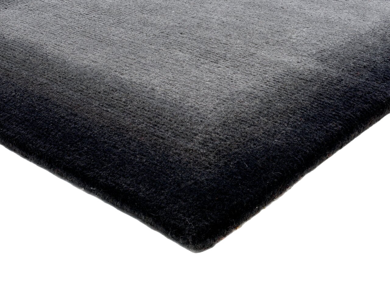 Eckperspektive auf einen rechteckigen Teppich in Grautönen, ca. 250x347cm