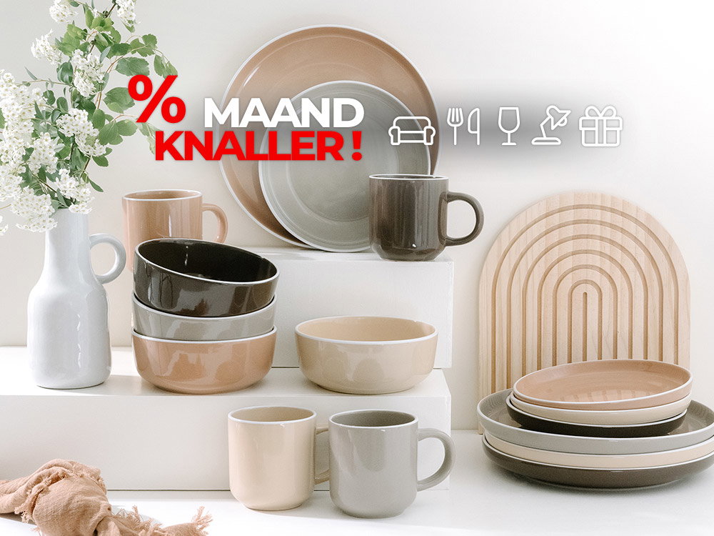 Maandknaller: Modern servies in beige, grijs en zwart met mokken, borden en kommen decoratief opgesteld.
