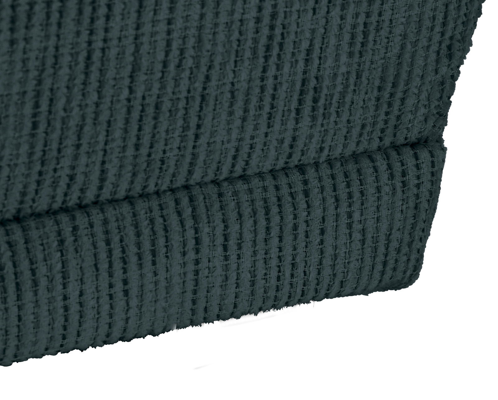 Nahaufnahme eines strukturierten, dunkelgrünen Stoffes einer Recamiere, seitliche Perspektive