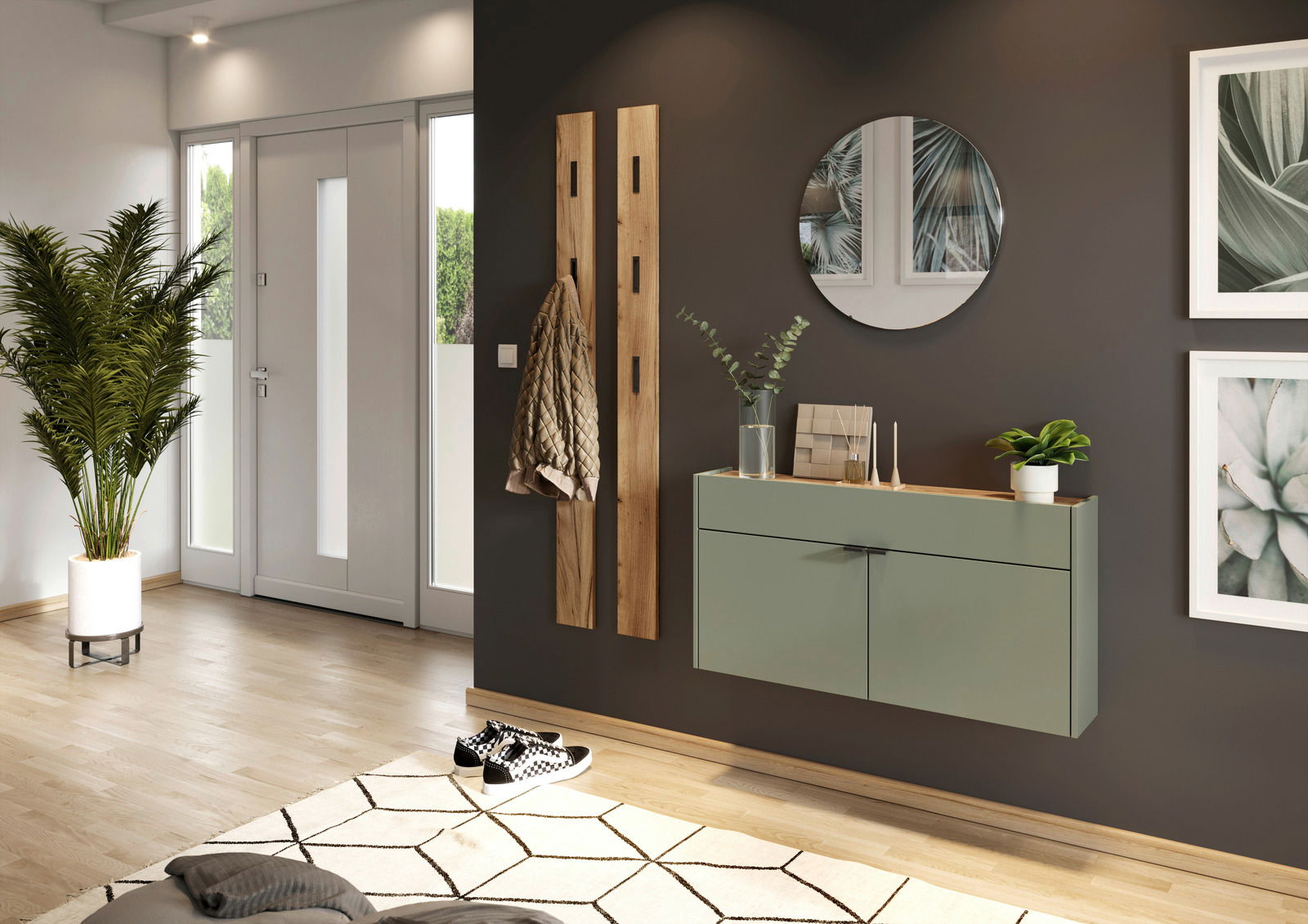 XORA Hängeschuhschrank breit AMECA Moderner Eingangsbereich mit einem hängenden Schuhschrank in Salbeigrün, einem runden Spiegel und zwei Holzgarderobenleisten. Perspektive von der Seite.