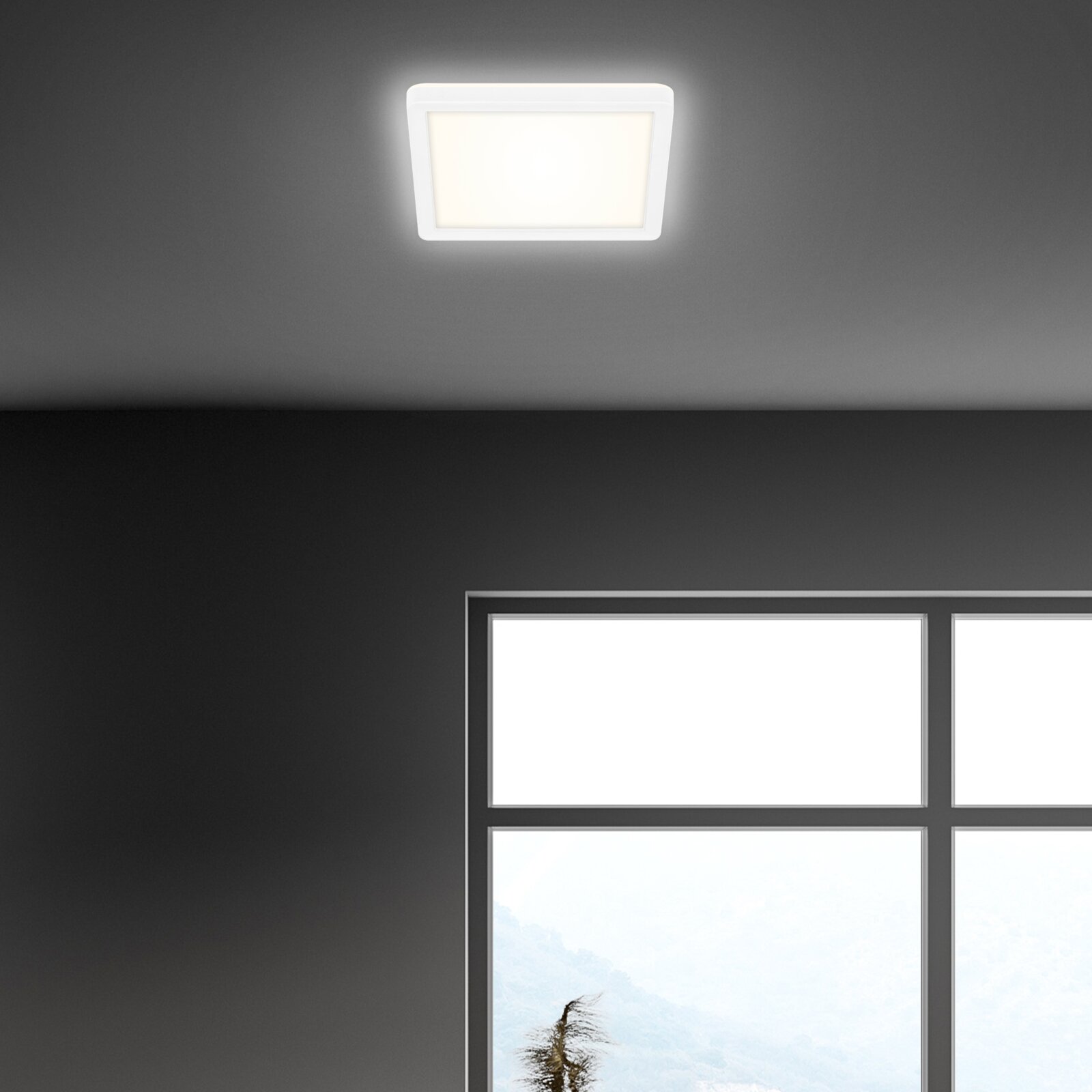 Vierkante led-plafondlamp in een modern interieur, gezien van onderaf