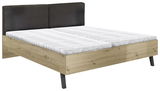 Modernes Doppelbett mit Holzrahmen und schwarzem Kopfteil, seitliche Perspektive
