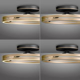 Moderne Deckenleuchte PURE Loop in Gold und Schwarz, seitliche Perspektive.