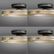 Moderne Deckenleuchte PURE Loop in Gold und Schwarz, seitliche Perspektive.