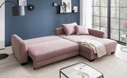 Rosa Ecksofa mit Schlaffunktion in einem modernen Wohnzimmer, seitliche Perspektive