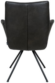 Achterkant van een moderne fauteuil met zwarte lederen bekleding en slanke metalen poten.