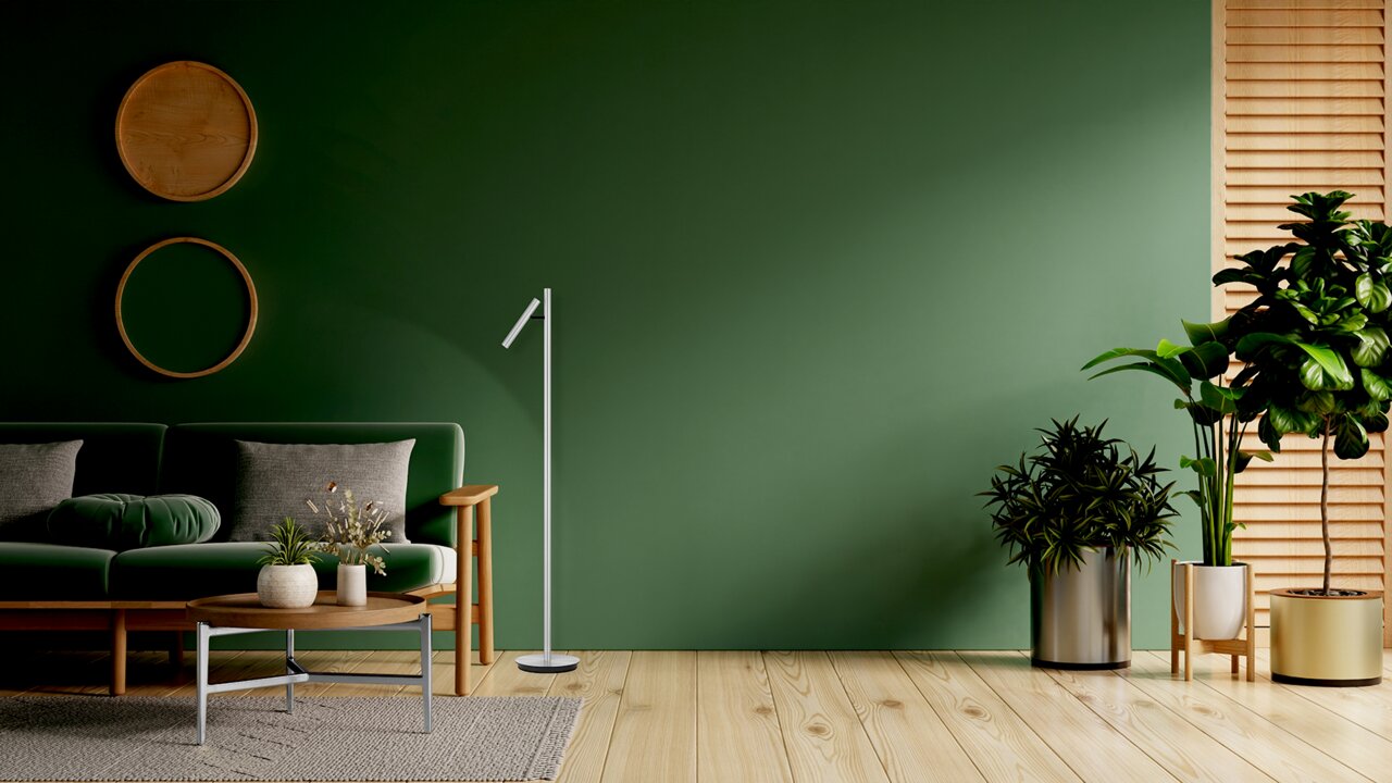Elements by Bankamp LED-Steh-/Leseleuchte ARNE Moderne LED-Steh- und Leseleuchte in einem stilvollen Wohnzimmer mit grüner Wand und Holzboden, seitliche Perspektive.
