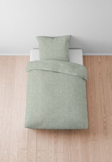 Grüne Bettwäsche 155x220cm auf einem Bett, von oben fotografiert, auf hellem Holzboden.