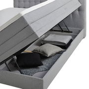 Boxspringbett mit geöffnetem Stauraum, seitliche Perspektive