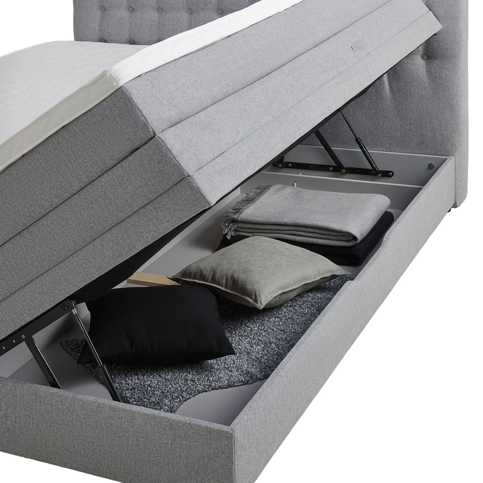 Boxspringbett mit geöffnetem Stauraum, seitliche Perspektive