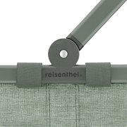 Close-up van het groene frame van een Carrybag met het logo 'reisenthel', gezien van voren.
