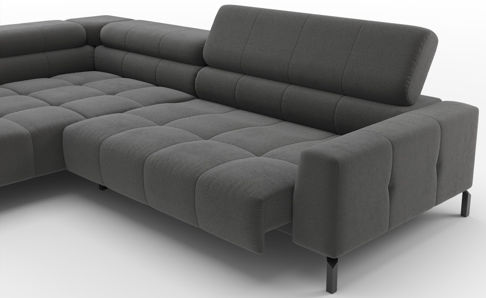 Donkergrijze hoekbank met ribstof bekleding, diepe zitting en verstelbare rugkussens, getoond in schuin vooraanzicht (driekwart) op een witte achtergrond.