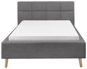 Grijs boxspringbed met doorgestikt hoofdeinde, gezien vanaf de voorkant