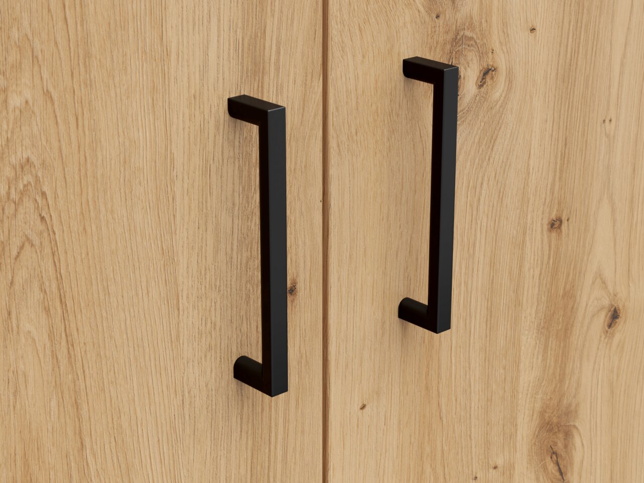 Carryhome Kommode MULTISTAURAUM Nahaufnahme von zwei schwarzen Griffen auf einer Holzkommode, frontale Perspektive