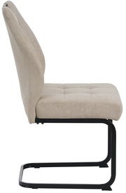 Seitenansicht eines beigen Schwingstuhls mit schwarzem Metallgestell.