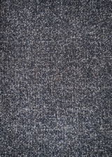 Nahaufnahme eines grauen Stoffmusters, das für einen Armlehnstuhl verwendet wird, von oben betrachtet.