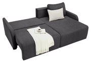 Graues Ecksofa mit ausziehbarer Liegefläche, dekoriert mit einem weißen Kissen und einer weißen Decke, aus der Vogelperspektive.