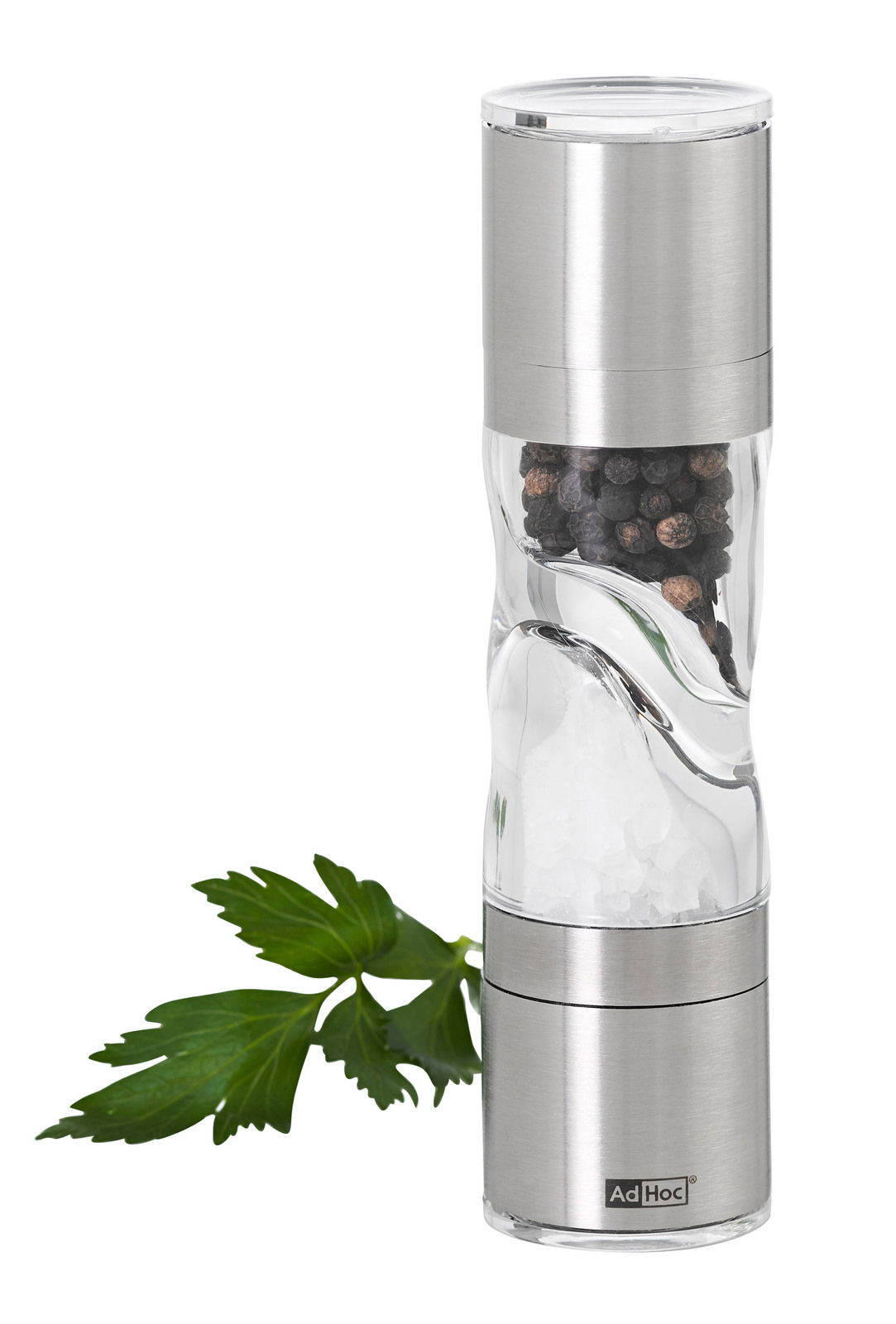 Pfeffer- und Salz-Doppelmühle aus Edelstahl und Glas, seitliche Ansicht mit Pfefferkörnern und grobem Salz, dekoriert mit einem Petersilienblatt.
