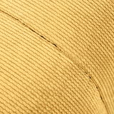 Nahaufnahme des Stoffes eines Hockers mit gerippter Textur in beige, seitliche Perspektive