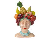 Keramik-Blumentopf in Form eines Frauenkopfes mit geschlossenen Augen, geschmückt mit bunten Früchten wie Ananas, Banane und Kirschen auf dem Kopf, Vorderansicht