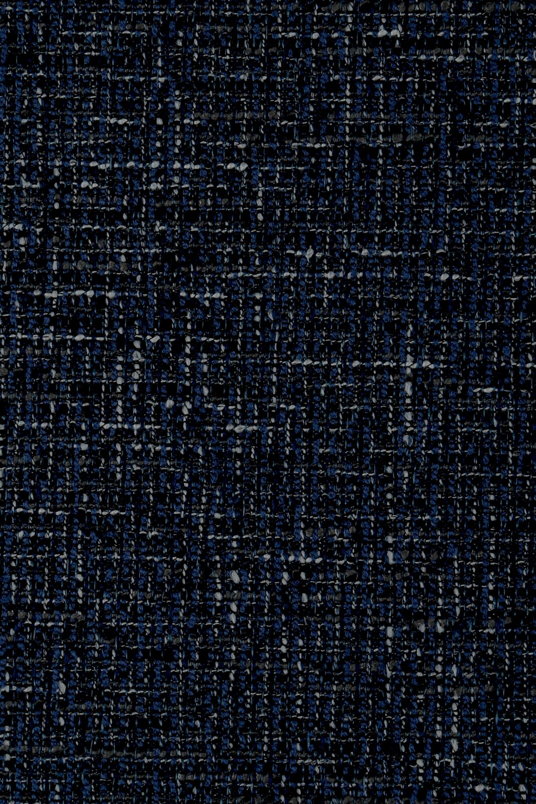 Close-up van een donkerblauw stoffenpatroon met een gestructureerd weefpatroon