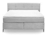 Frontale Ansicht eines grauen Boxspringbetts mit gestepptem Kopfteil und weißen Matratzenauflagen.