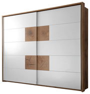 Schwebetürenschrank mit zwei Türen in Holzoptik und weißen Paneelen, seitliche Perspektive