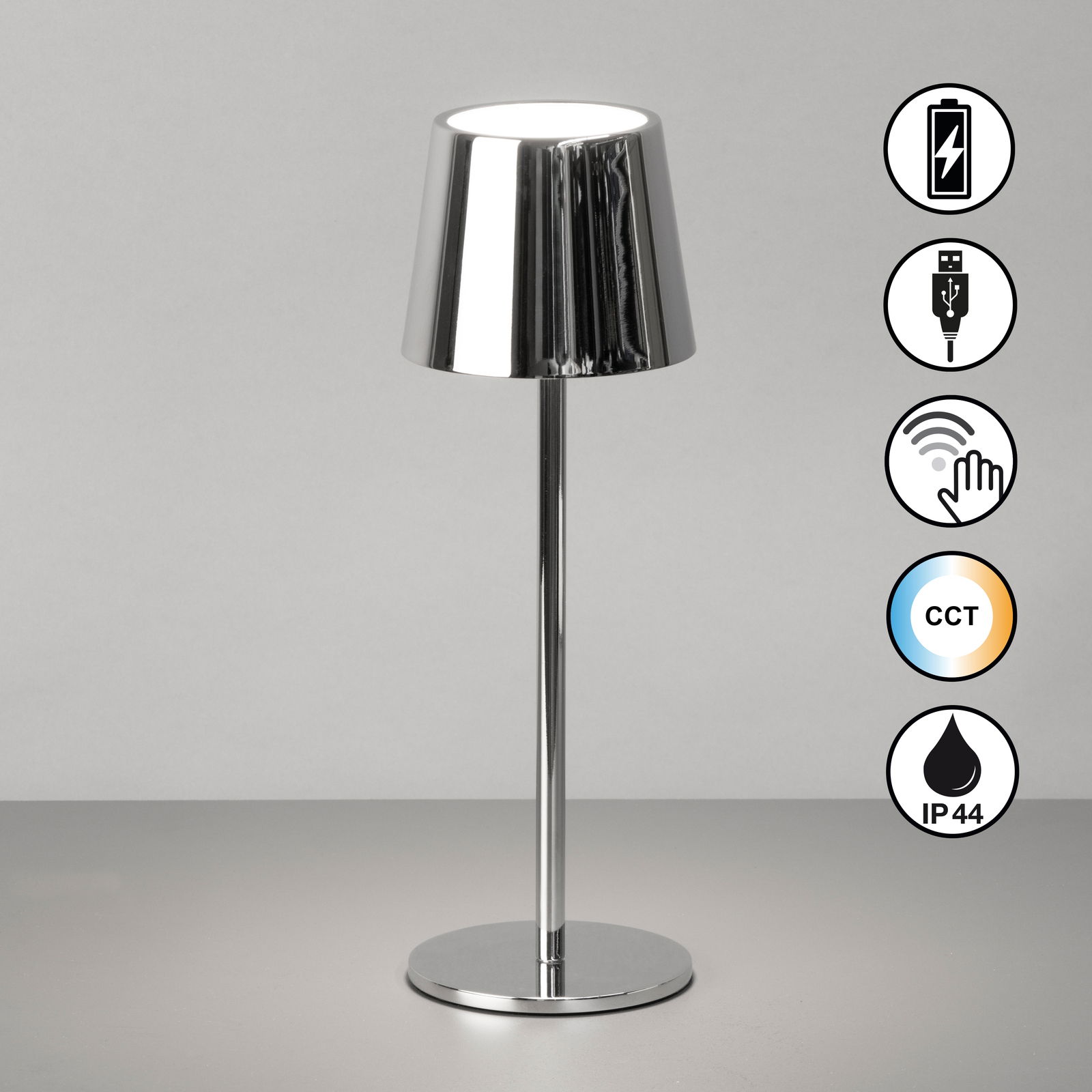 Moderne Akku-Tischleuchte ROXI in glänzendem Chrom-Design, frontal abgebildet mit Symbolen für wiederaufladbaren Akku, USB-Anschluss, Touch-Bedienung, einstellbare Farbtemperatur (CCT) und Schutzart IP44.