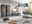 Moderner Wohnraum mit Dieter Knoll Möbeln: dunkle Schrankwand, Sideboard, Couchtische und Sofa in stilvollem Ambiente