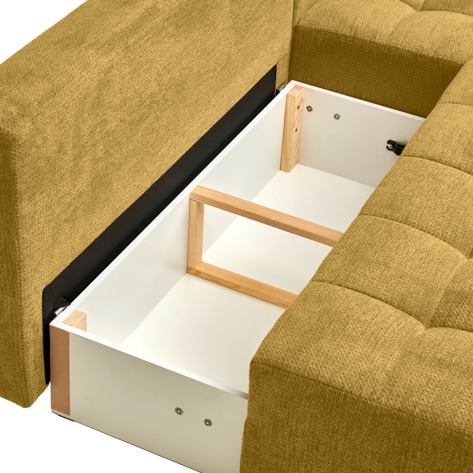 Nahaufnahme eines Ecksofas MEZZO mit Ottomane rechts, das einen geöffneten Stauraum mit Holzrahmen zeigt. Perspektive von oben.