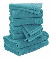 Ein Stapel von türkisfarbenen Handtüchern, seitliche Perspektive