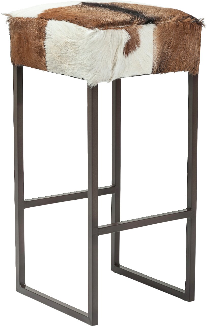 Karé Kruk COUNTRY LIFE Moderne poef met een bekleding van bont in bruin- en wittinten, zijaanzicht
