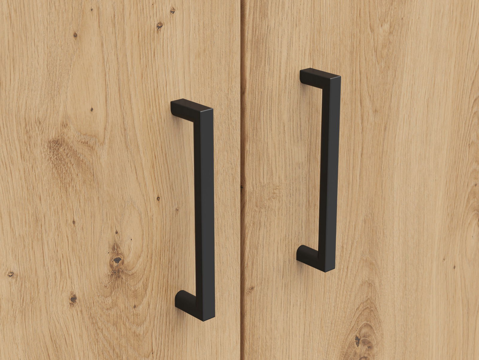Nahaufnahme von zwei schwarzen Griffen an einer Holztür eines Mehrzweckschranks, aus der Frontalperspektive.