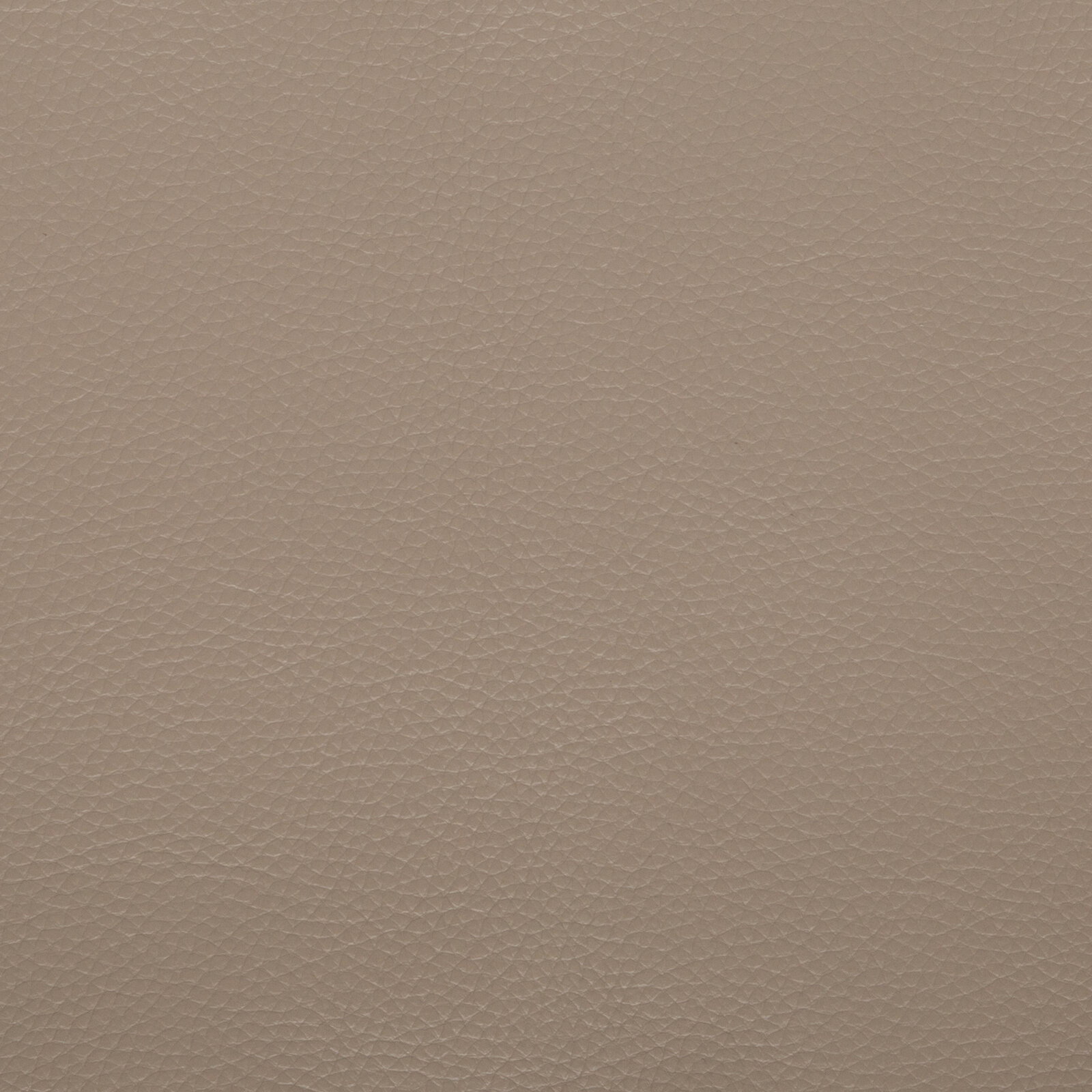 Nahaufnahme einer beigen Leder- bzw. Kunstlederoberfläche mit feiner Narbung, frontal von oben fotografiert