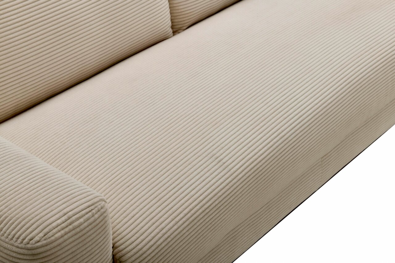 Nahaufnahme eines beigen Funktionssofas mit geripptem Stoffbezug, Perspektive von oben.