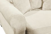 Nahaufnahme eines beigen Funktionssofas mit geripptem Stoffbezug, Blick auf die Armlehne und Sitzfläche.