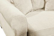 Close-up van een beige functionele bank met geribbelde stoffen bekleding, met een blik op de armleuning en de zitting.