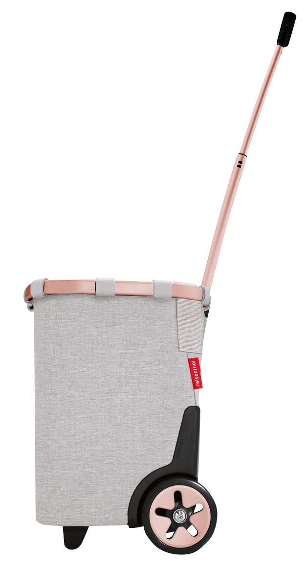 Reisenthel Carrycruiser Seitenansicht eines grauen Carrycruiser mit roségoldenem Griff und Rädern.