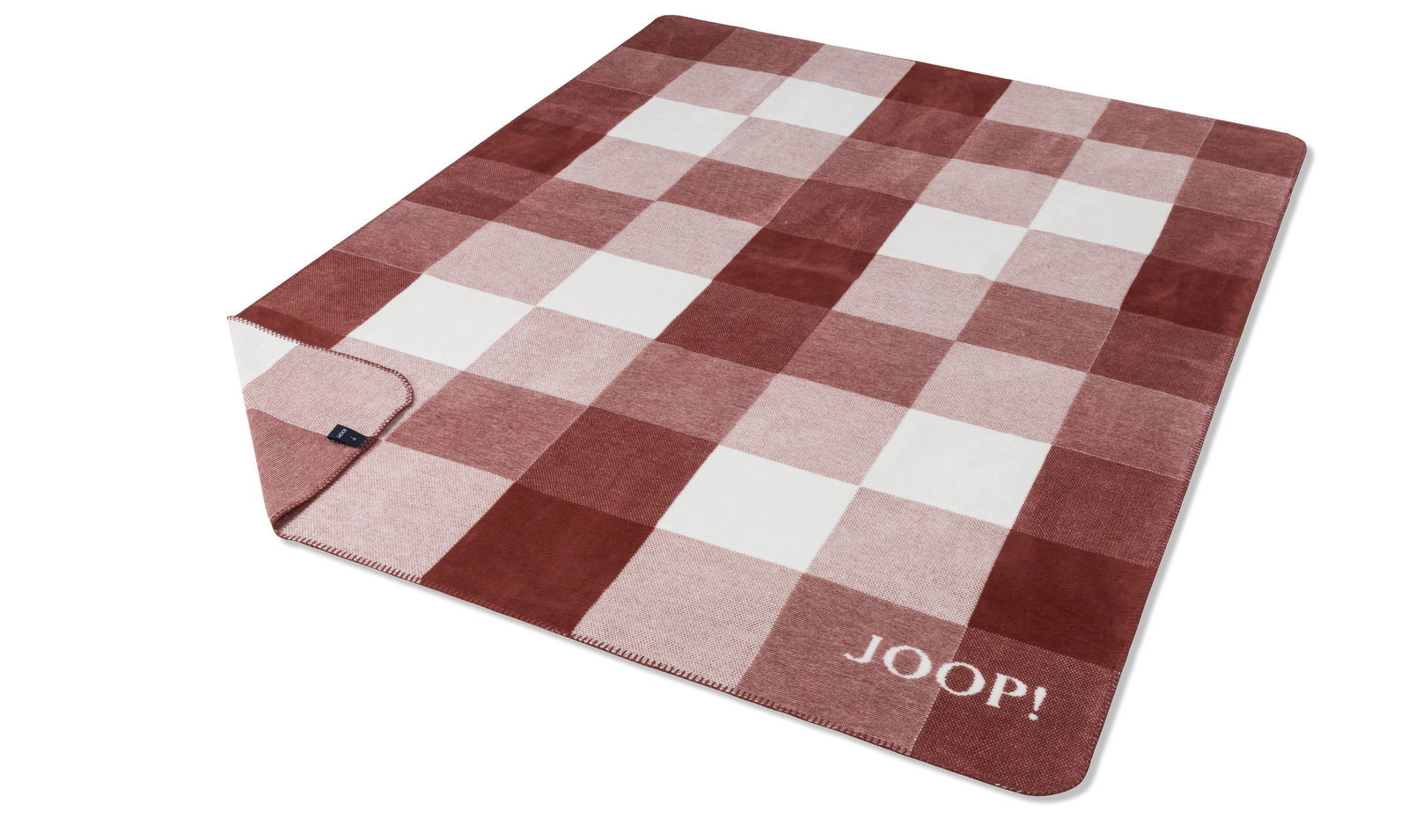 JOOP! Woonkleed J! Mesh Rote und weiße karierte Decke mit dem Schriftzug 'JOOP!' in der Ecke, aus schräger Vogelperspektive fotografiert.