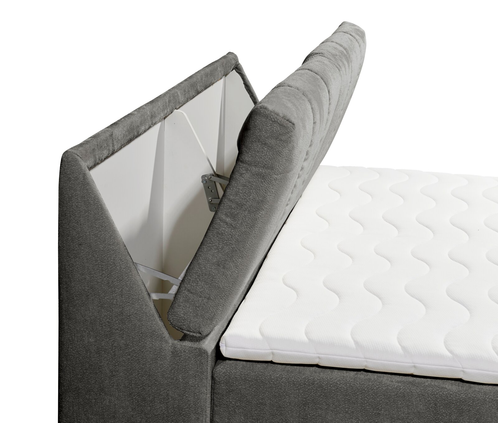 Zijaanzicht van een grijs boxspringbed met geopende opbergruimte en een wit matras.