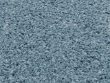 Nahaufnahme eines blauen Uni-Teppichs mit weicher, flauschiger Textur.