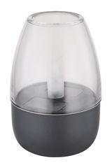 Nahaufnahme einer modernen Solarleuchte mit transparentem Gehäuse und schwarzem Sockel, seitliche Perspektive.