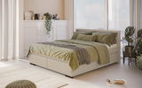 Boxspringbett in einem modernen Schlafzimmer mit grüner Bettwäsche, seitliche Perspektive