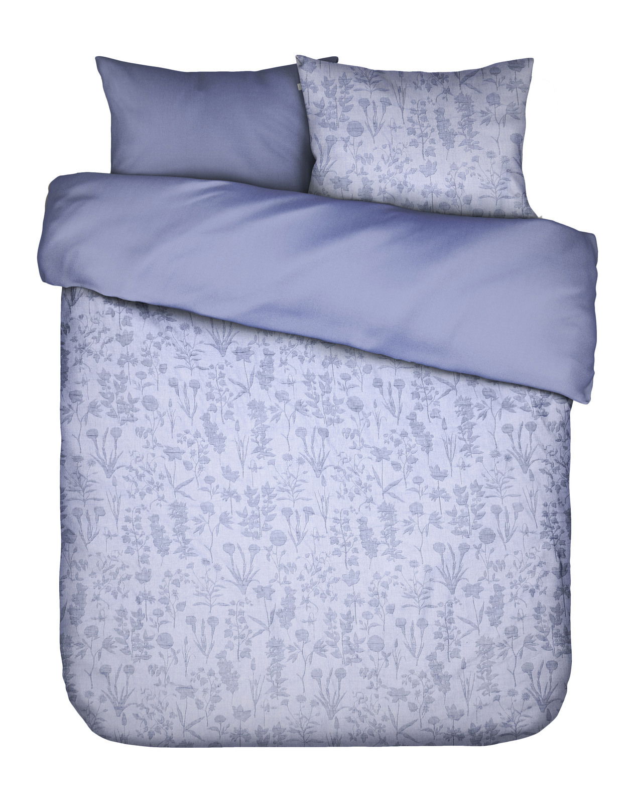 Bettwäsche-Set in Blau mit floralem Muster, bestehend aus einem Kissenbezug und einem Bettdeckenbezug, aus der Vogelperspektive fotografiert.
